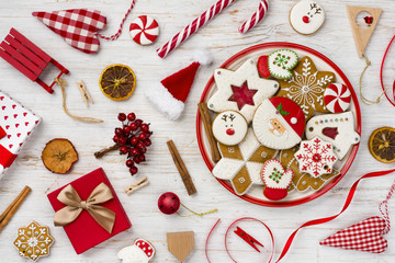Traditional christmas gingerbread, toys and decor isolated on wooden background