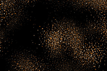 Golden explosion of confetti. Shiny dust, amber particles, lots of bright stars. Gold glitter texture isolated on black, celebration background