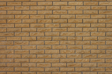 The wall of decorative facing bricks. Close-up 