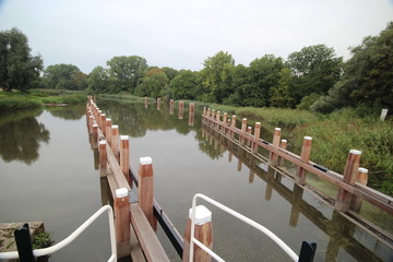 Sluice complex Gojanverwellesluis in river Hollandsche IJssel at Gouda where tide river will change...