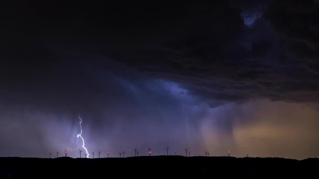 Time Lapse of a thunderstorm over windmills
