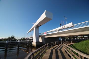 Steel drawbridge over river Hollandsche IJssel named gouderaksebrug to connect Krimpenerwaard with city of Gouda in the Netherlands.