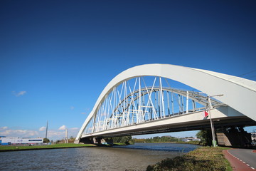 White bridges for trains between Amsterdam and Utrecht named Demkabrug and Werkspoorbrug in Utrecht over the Amsterdam-Rhine canal in the Netherlands