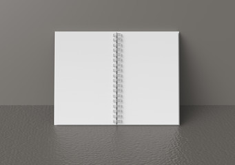 White hard cover book lean on wall