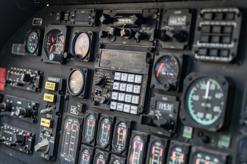 Helicopter cockpit. Details of dashboard, control panel, indicators and fire buttons. War machine, air bomber. 