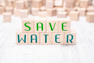 The Words Save Water Formed By Wooden Blocks On A White Table