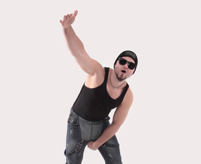 male hip-hop dancer posing in the Studio. Isolated on white background .