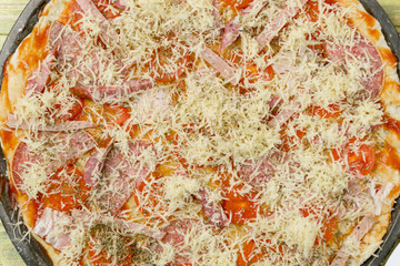 Fresh original Italian raw pizza, dough preparation in traditional style.