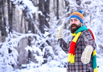 Fototapeta na wymiar Macho with beard and mustache plays with snowball.