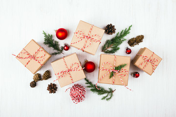Christmas gift boxes collection with pine cones, evergreen branches, candy cane Christmas rope and...
