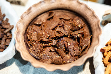 Dry baked rye wholegrain crunchy crouton bread sticks on plate. Natural tasty crispy snack. Delicious nutrition homemade grain appetizer