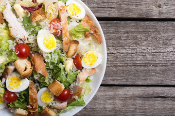 Salad ceasar with chicken , eggs and tomatoes