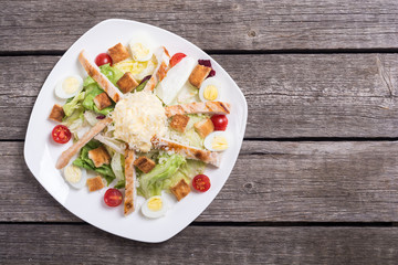 Salad ceasar with chicken , eggs and tomatoes