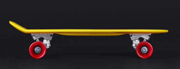 Yellow cruiser penny plastboard with red wheels