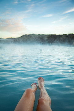 Woman Relaxes And Enjoys Of Spa In Hot Spring Blue Lagoon In Ice