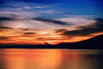 Fototapeta na wymiar Mountain lake evening light