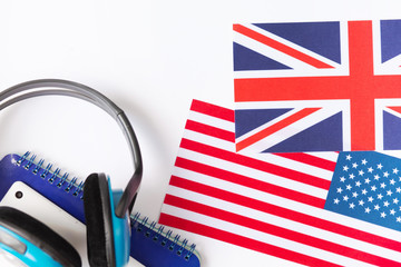 Learn English - British flag, headphones, tablet and notebook on white background