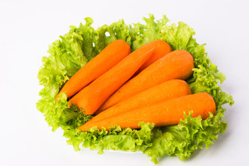 Obraz na płótnie Canvas 3 carrots and lettuce leaves