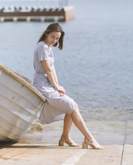 Young woman sitting down on the boat.