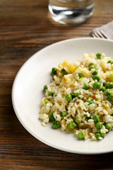 Healthy rice with green peas on plate