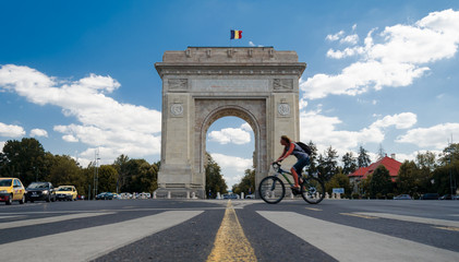 Bucharest, Romania, August 2018: Tourist on bicycle explores the city