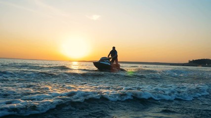 Person doing stunts on a jet ski, close up.