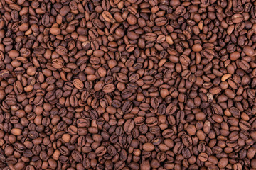 Roasted arabica coffee beans background or texture