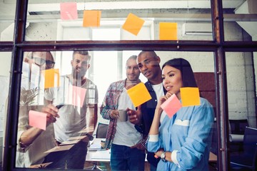 Business people meeting at office and use post it notes to share idea. Brainstorming concept....