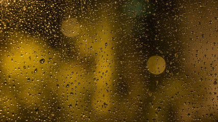 Raindrops on the window glass. The view from the window