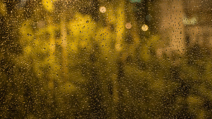 Raindrops on the window glass. The view from the window