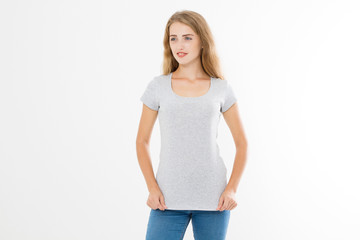 Obraz premium Young blonde woman with fit slim body in blank template t shirt and jeans isolated on white background. Skin and hair care. Copy space and mock up