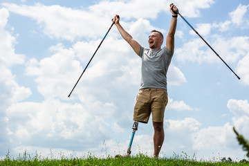Elated young man with disability feeling happy