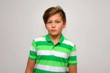 Studio portrait of a teenage boy on a white background with different emotions.