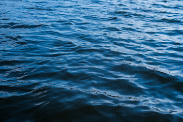 Background of deep blue river water surface.
