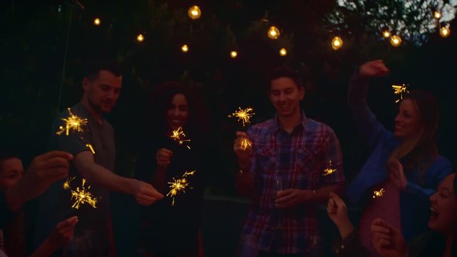 Friends holding sparklers 