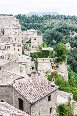 Fototapeta na wymiar Sorano, Grosseto, Tuscany, Italy. Small medieval town of stone houses. The village is on a hill surrounded by forests