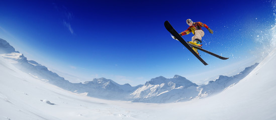 Skiing. Jumping skier. Extreme winter sports.
