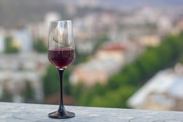 one glasses of wine on the roof of the town


