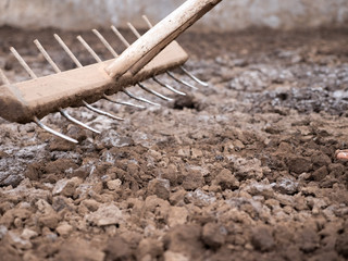 Working on the production of natural sea salt. Production of sea salt in the Bali,Indonesia. Salt crystallizes out of the ground in salt farm.