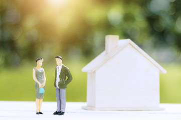 couple love talking about real estate and house, business people discussing about financial home with green bokeh background