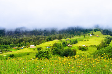 low clouds over the village in the mountains. Ukraine Carpathians
