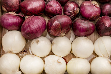 purple and white onions on wooden board