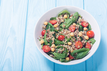 Spinach salad with quinoa , tomatoes and chickpea