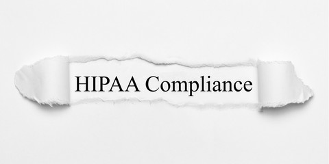 HIPAA Compliance on white torn paper