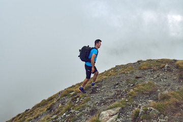 Obraz premium Hiker with backpack in the mountains