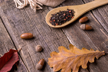 Tea with spices on a wooden background