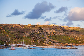 Port of Mgarr on the small island of Gozo, Malta. Winter sunset.