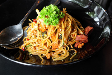 Spicy Spaghetti with Fried Ham in Black Plate