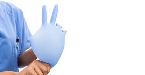 Woman nurse holding inflated  surgical glove making peace gesture.