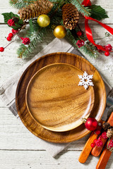 Festive table setting for holiday. Christmas decoration, plate and cutlery on festive table. Christmas background. Top view with copy space.